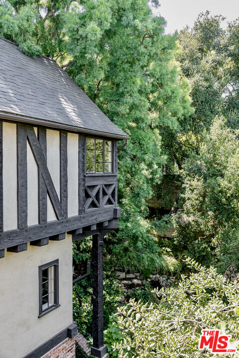 3701 Shannon Road Los Angeles, CA 90027 - Photo 52 of 54 a view of a house with a window and balcony