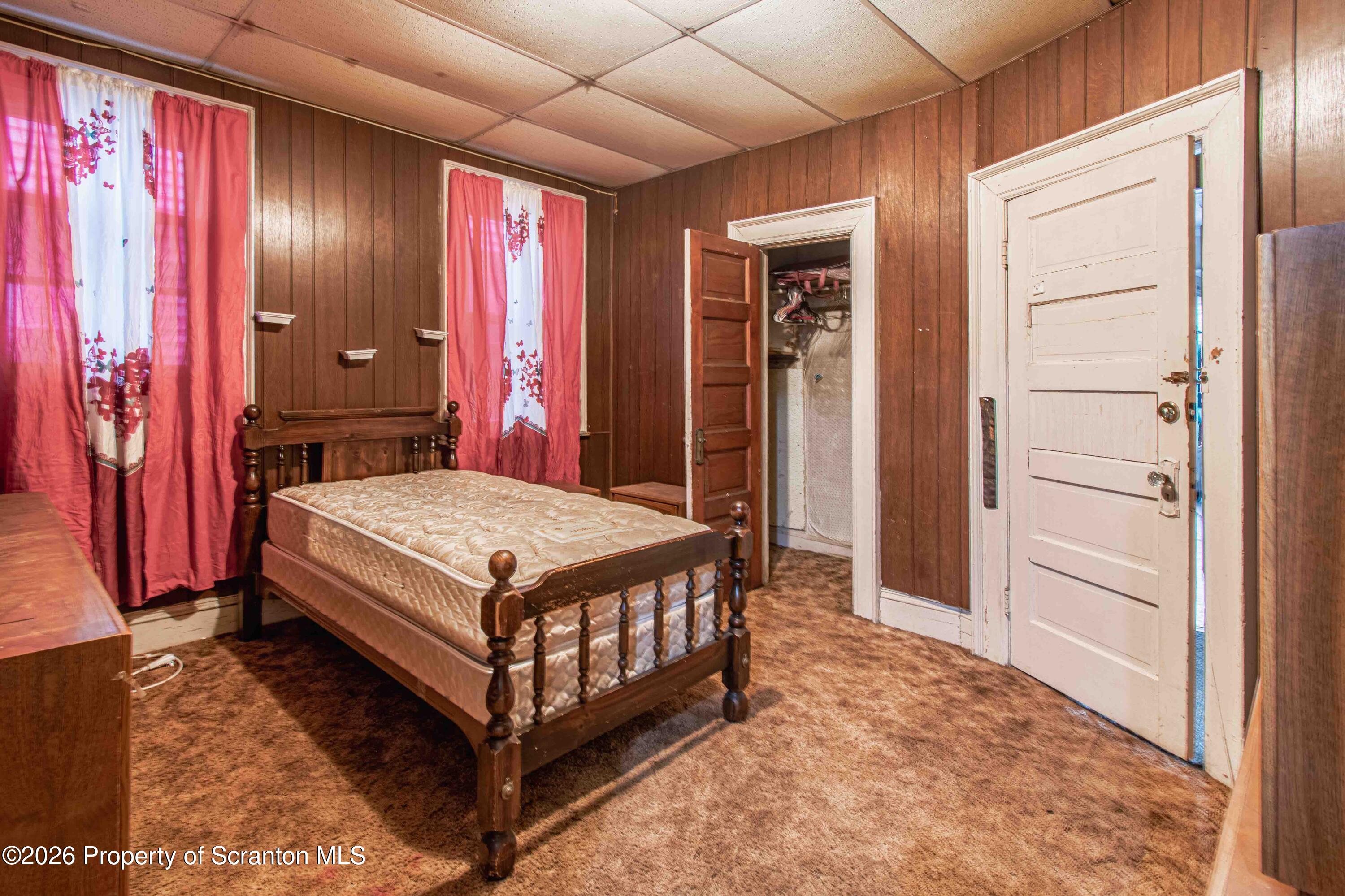 844 Monroe Avenue, Unit 844 Scranton, PA 18510 - Photo 13 of 15 a bedroom with a bed and window