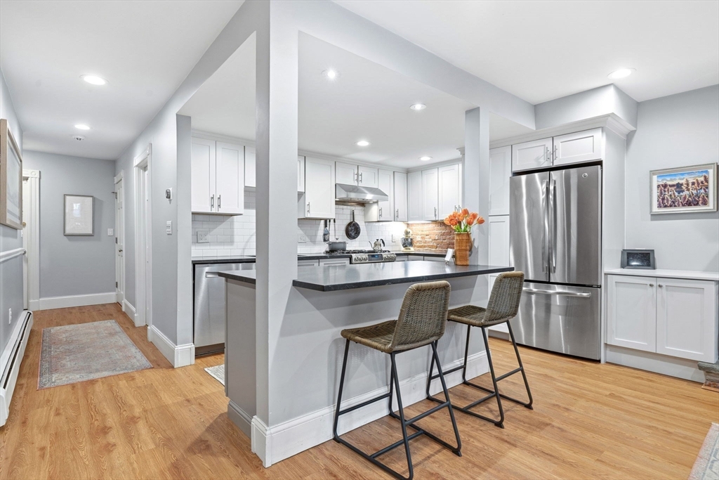 35 High Street, Unit 1 Boston, MA 02129 - Photo 22 of 33 a kitchen with stainless steel appliances a refrigerator and a stove top oven