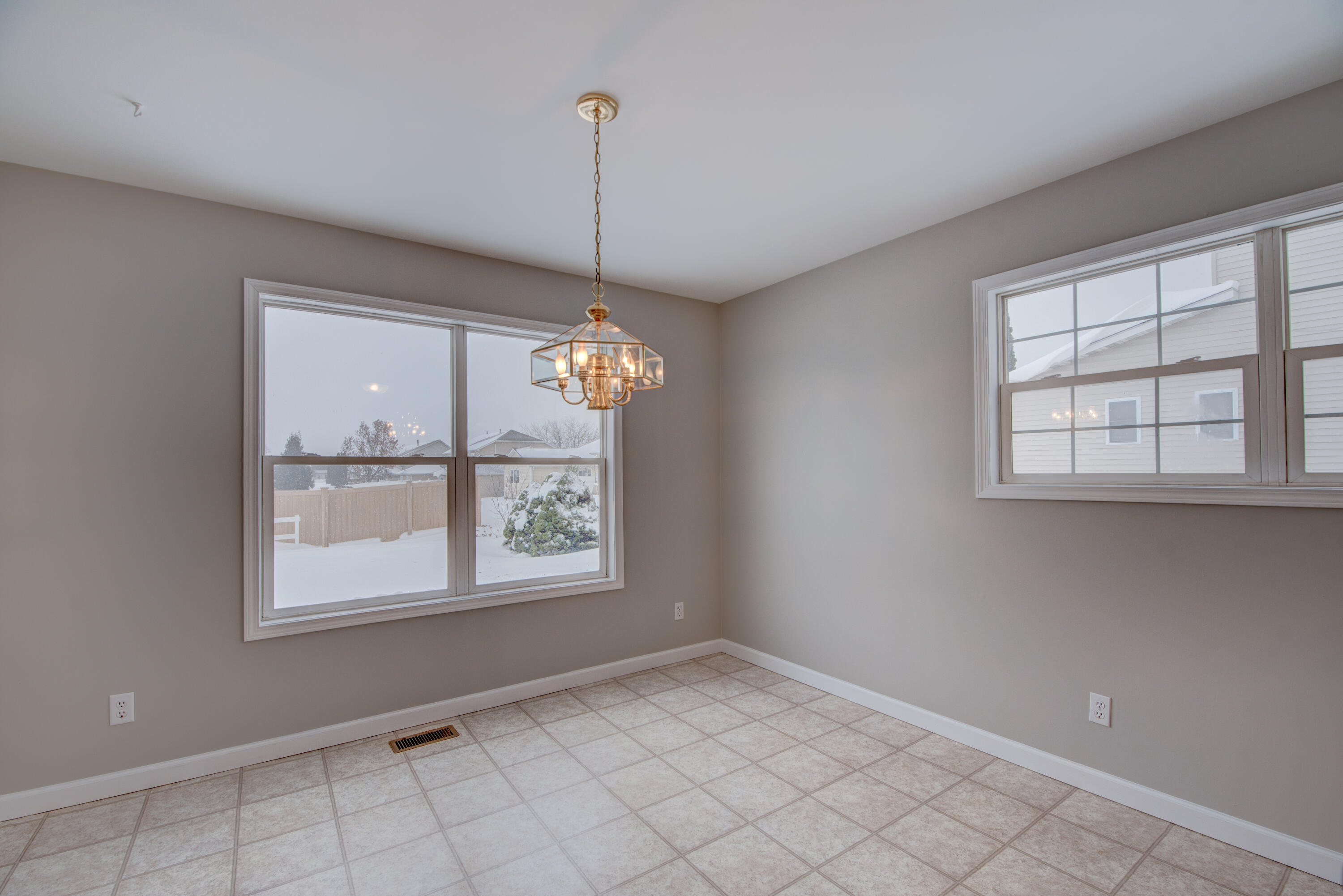 7736 East 108th Avenue, Unit C Crown Point, IN 46307 - Photo 13 of 28 a view of an empty room with a window