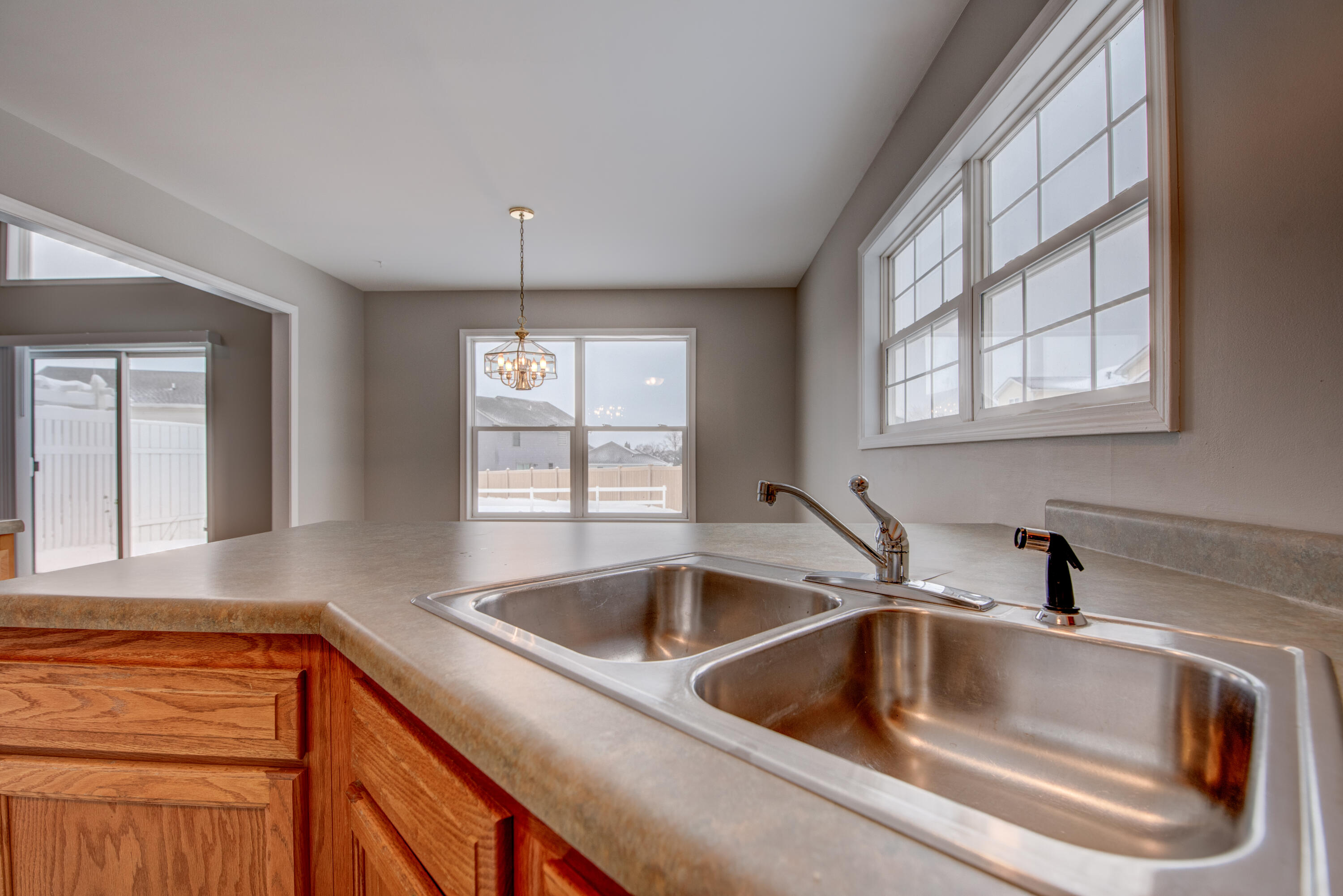 7736 East 108th Avenue, Unit C Crown Point, IN 46307 - Photo 14 of 28 a kitchen with sink and window