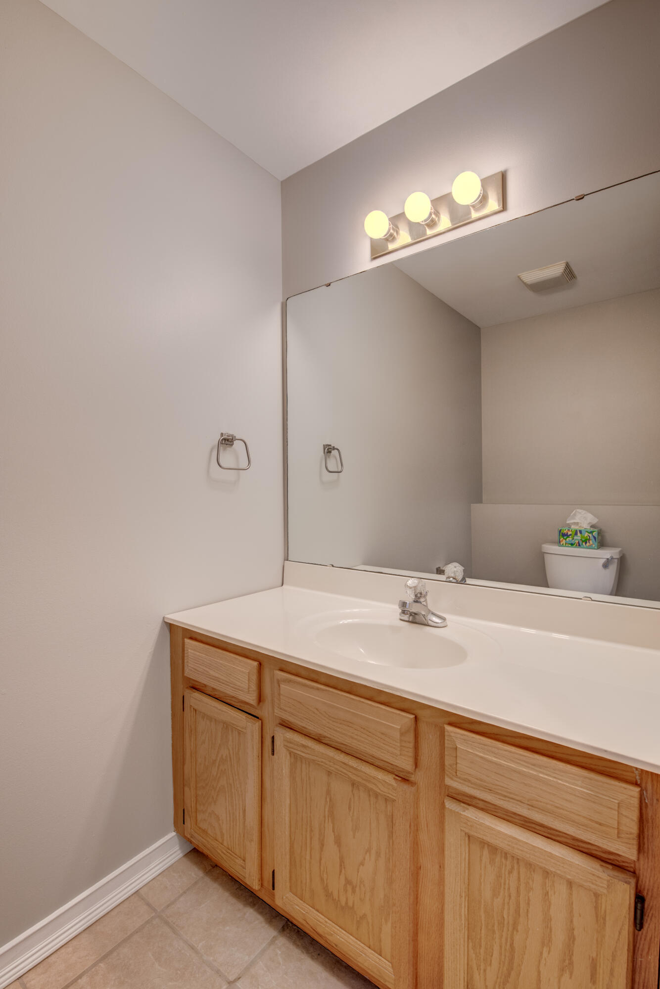 7736 East 108th Avenue, Unit C Crown Point, IN 46307 - Photo 17 of 28 a bathroom with a sink and a mirror
