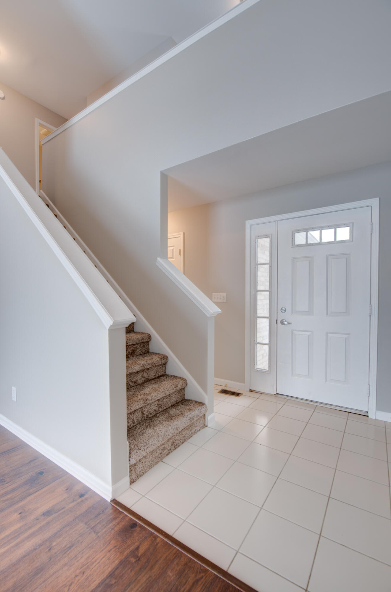 7736 East 108th Avenue, Unit C Crown Point, IN 46307 - Photo 19 of 28 a view of an entryway with wooden floor