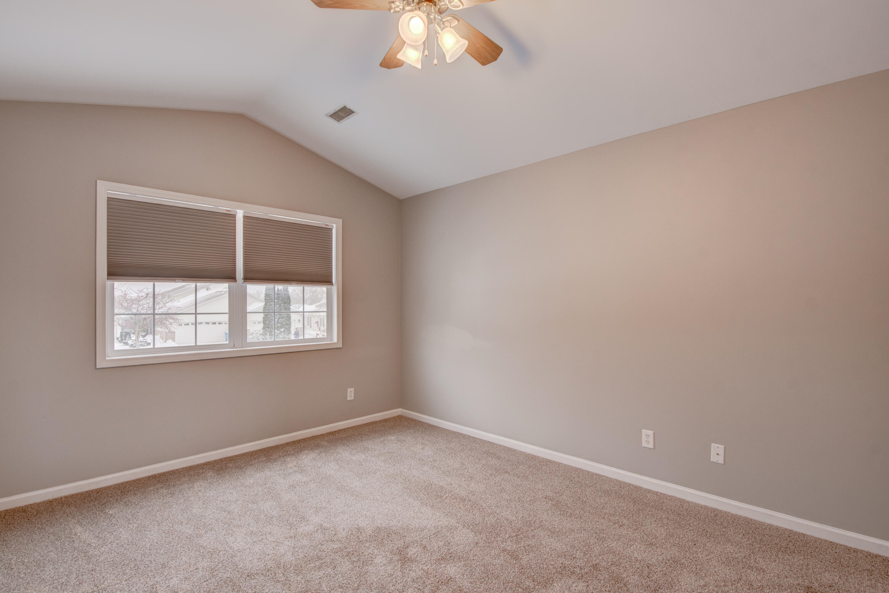 7736 East 108th Avenue, Unit C Crown Point, IN 46307 - Photo 24 of 28 an empty room with a window