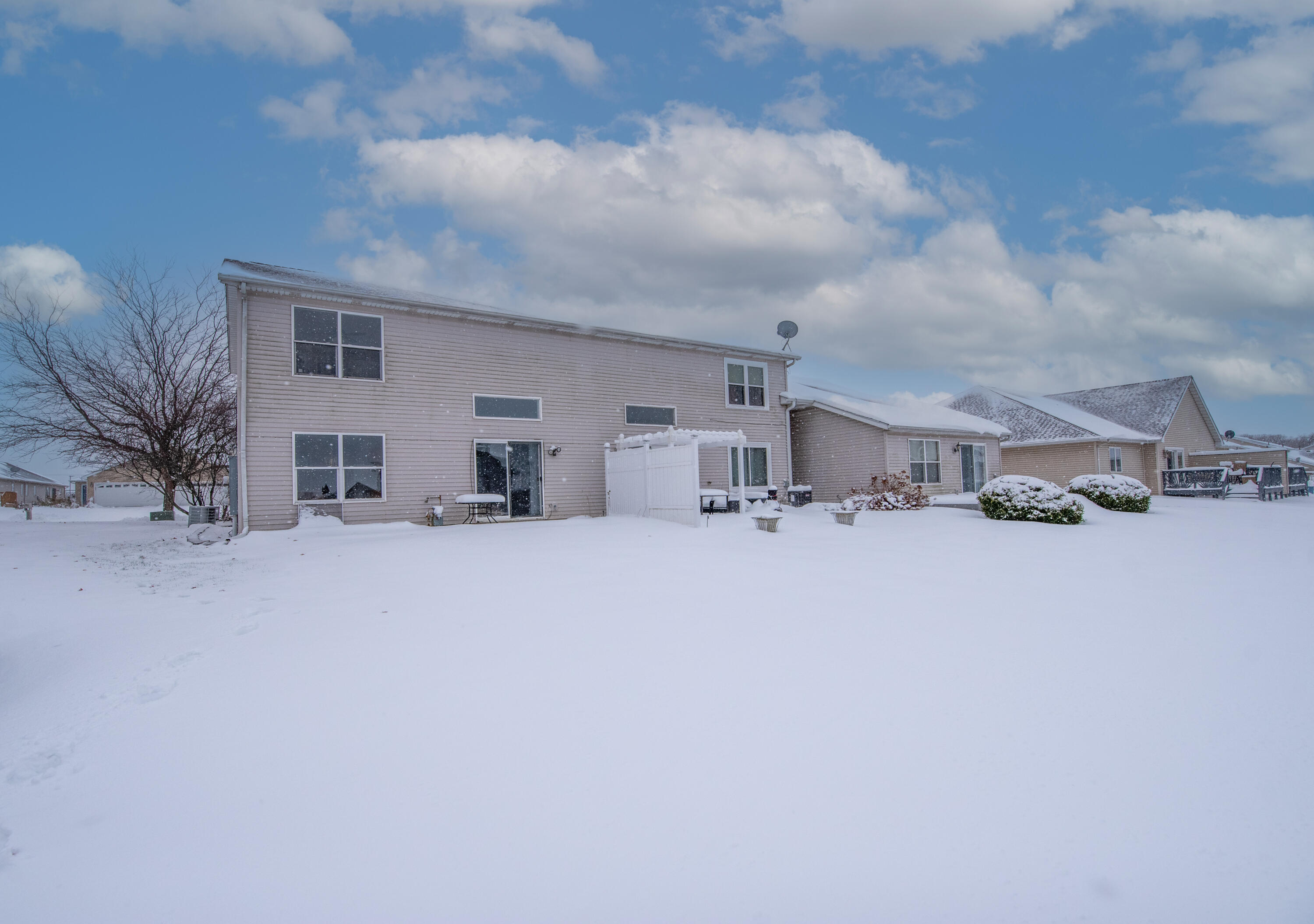 7736 East 108th Avenue, Unit C Crown Point, IN 46307 - Photo 28 of 28 a view of house with car parked in front of house