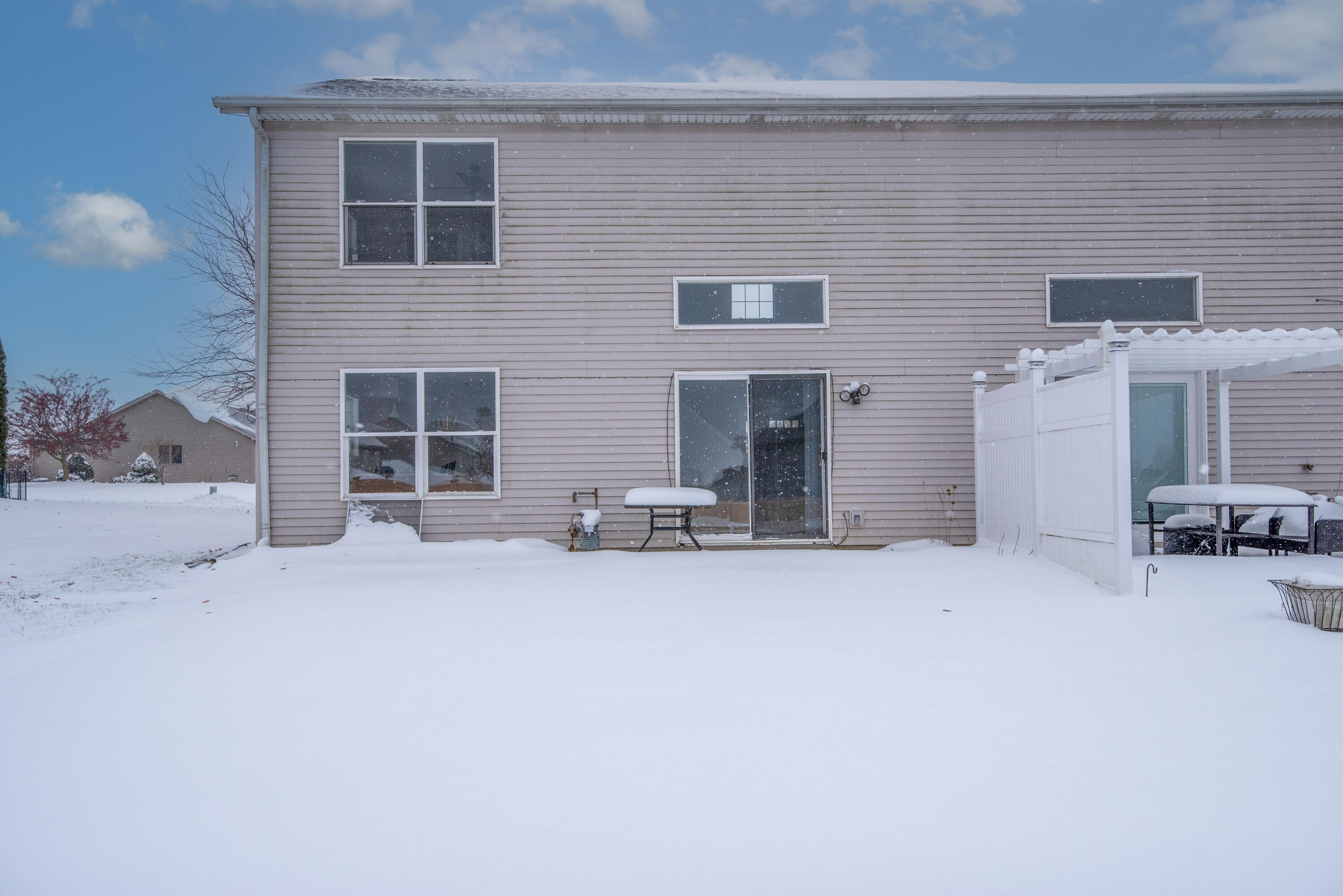 7736 East 108th Avenue, Unit C Crown Point, IN 46307 - Photo 5 of 28 a view of a house with a patio