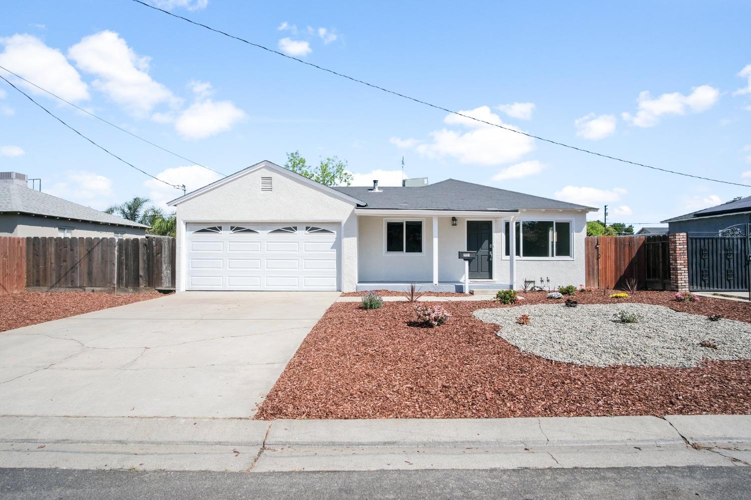2721 Joy Avenue Ceres, CA 95307 - Photo 1 of 1 a front view of a house with entertaining space