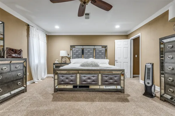 a living room with stainless steel appliances kitchen island furniture and a window