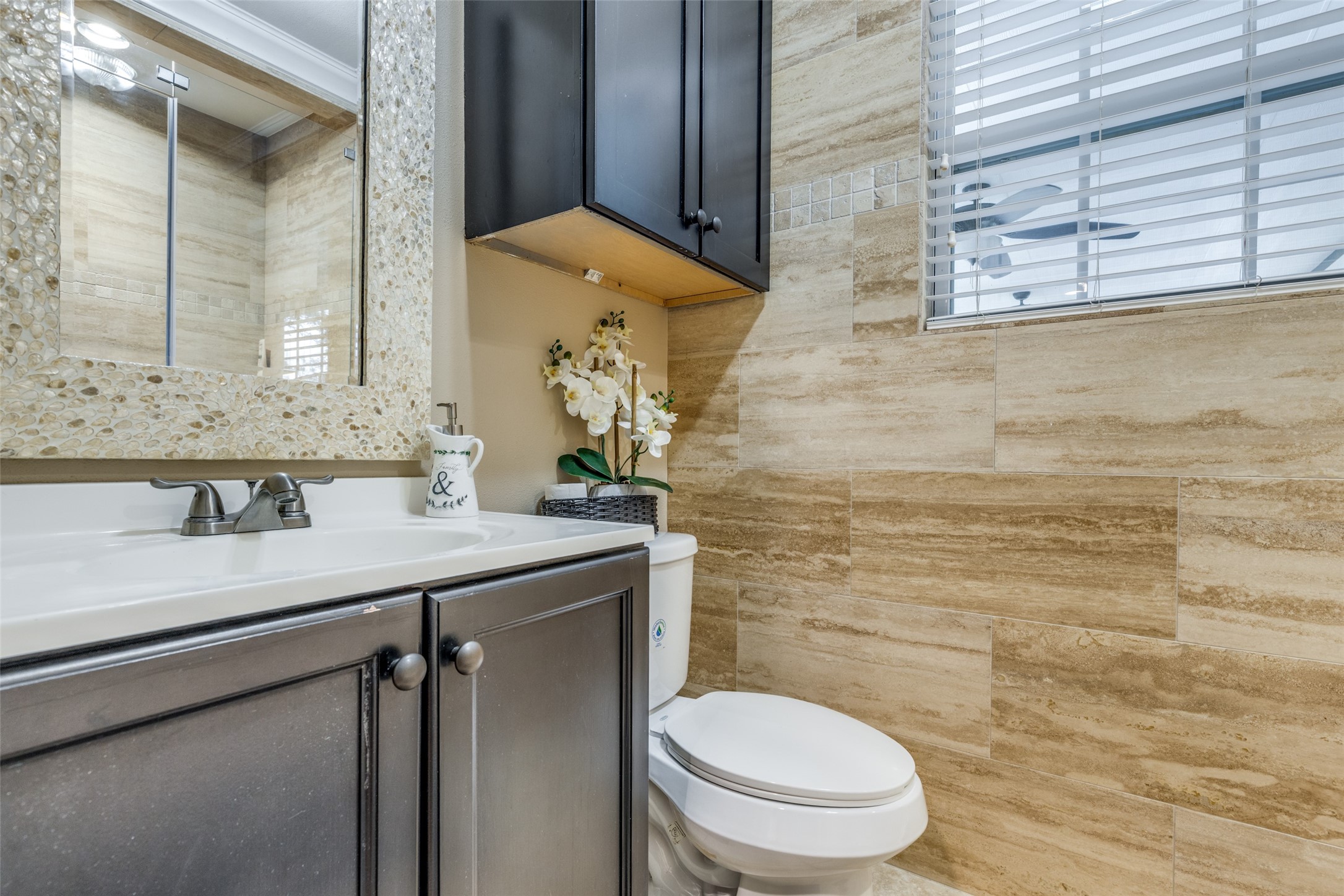 7953 Hammerly Boulevard Houston, TX 77055 - Photo 15 of 24 a bathroom with a granite countertop toilet sink and mirror
