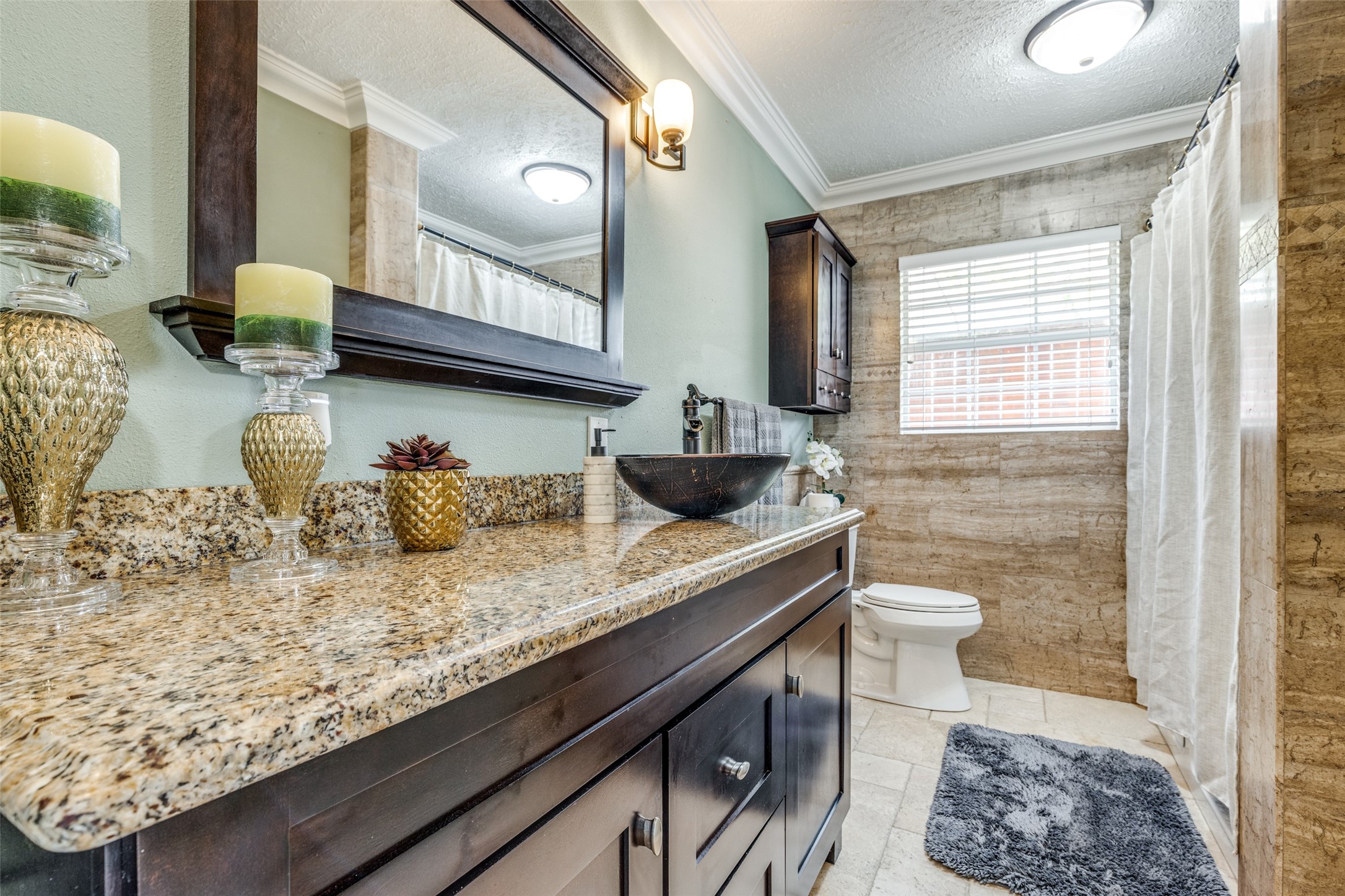 7953 Hammerly Boulevard Houston, TX 77055 - Photo 17 of 24 a bathroom with a granite countertop sink and a mirror