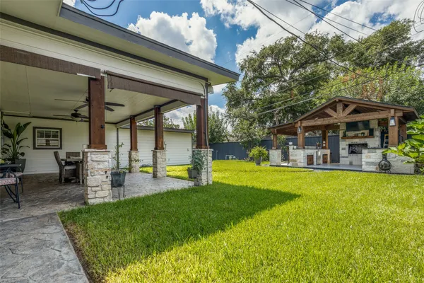 a view of a house with a yard porch and sitting area