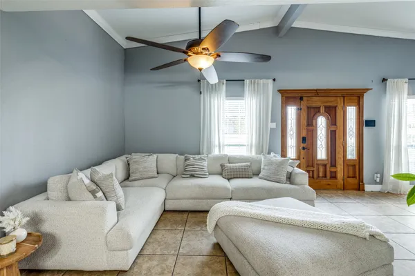 a living room with furniture and window