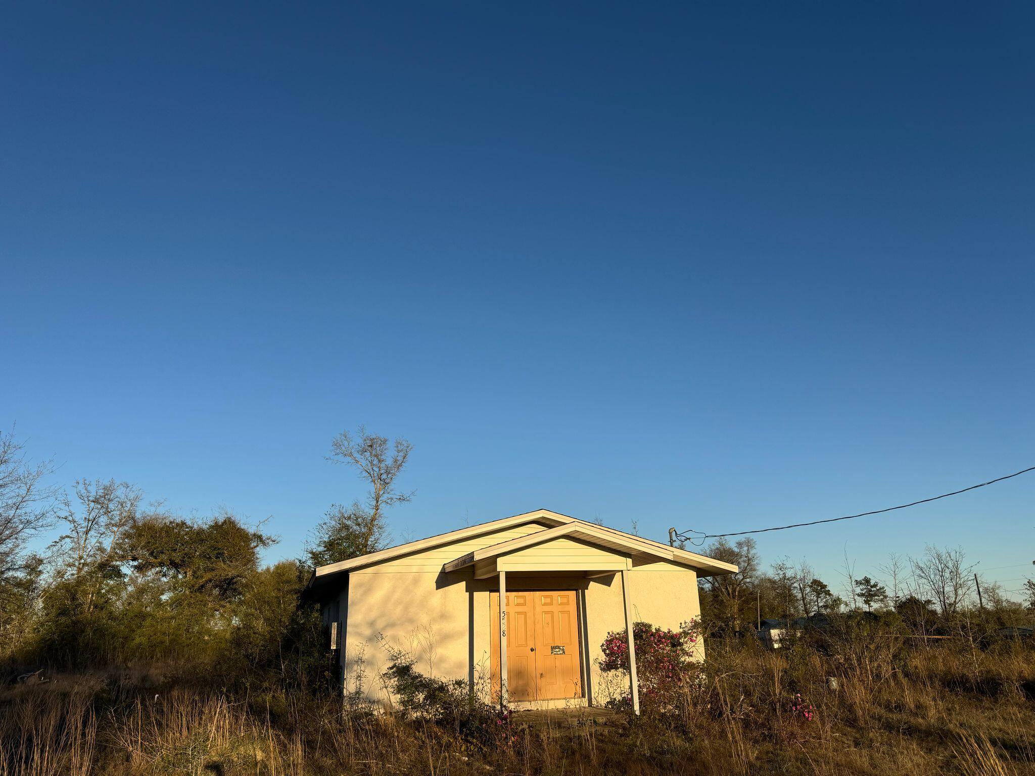 5528 Adalee Road Panama City, FL 32404 - Photo 1 of 7 a front view of a house with a yard
