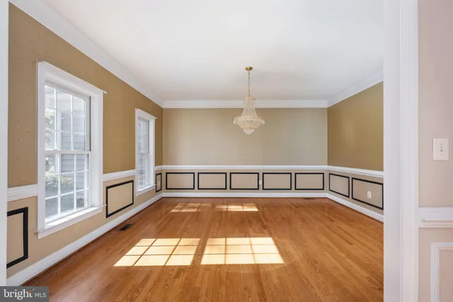 a kitchen with stainless steel appliances granite countertop a refrigerator a sink a stove and oven