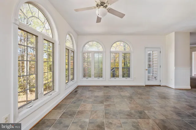 a white bath tub sitting next to a window