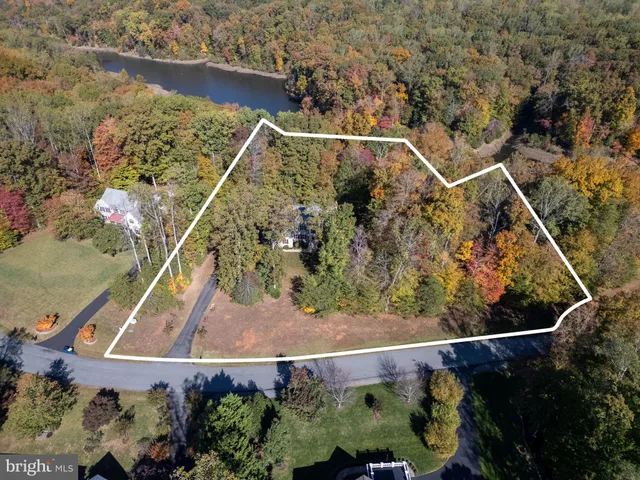 an aerial view of residential house with outdoor space