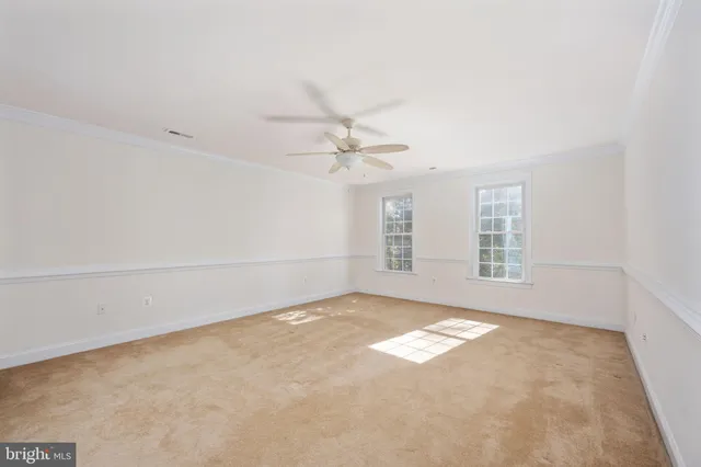 a view of a hallway with wooden floor and closet area