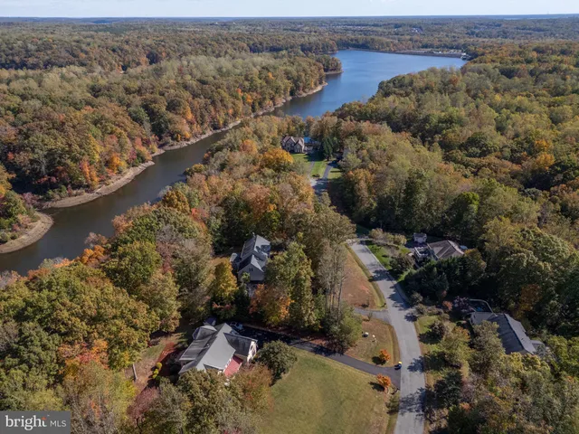 a aerial view of a house with a yard