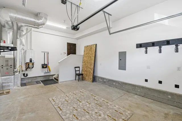 a view of a workspace with furniture and a gate