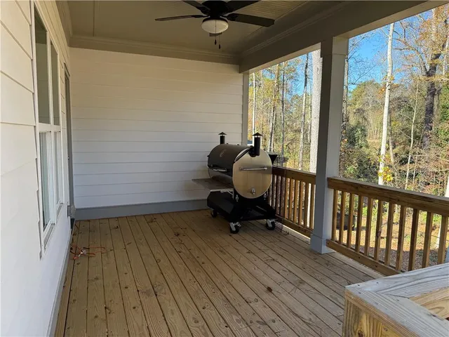 a living room with wooden floor furniture and a window