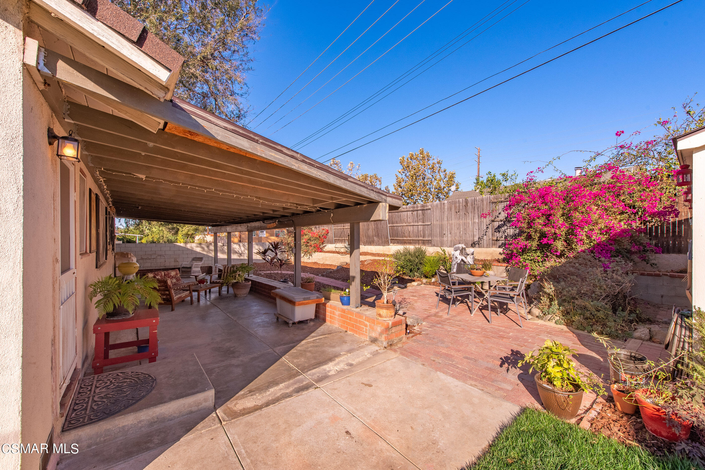 4109 Angela Street Simi Valley, CA 93063 - Photo 21 of 31 a view of a patio with table and chairs potted plants