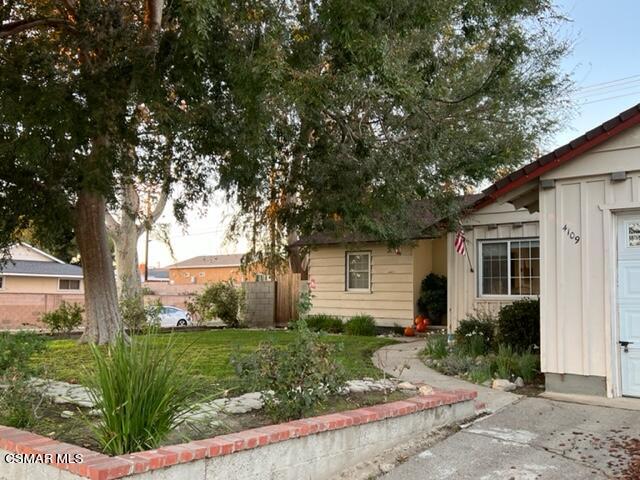 4109 Angela Street Simi Valley, CA 93063 - Photo 5 of 31 a front view of a house with garden