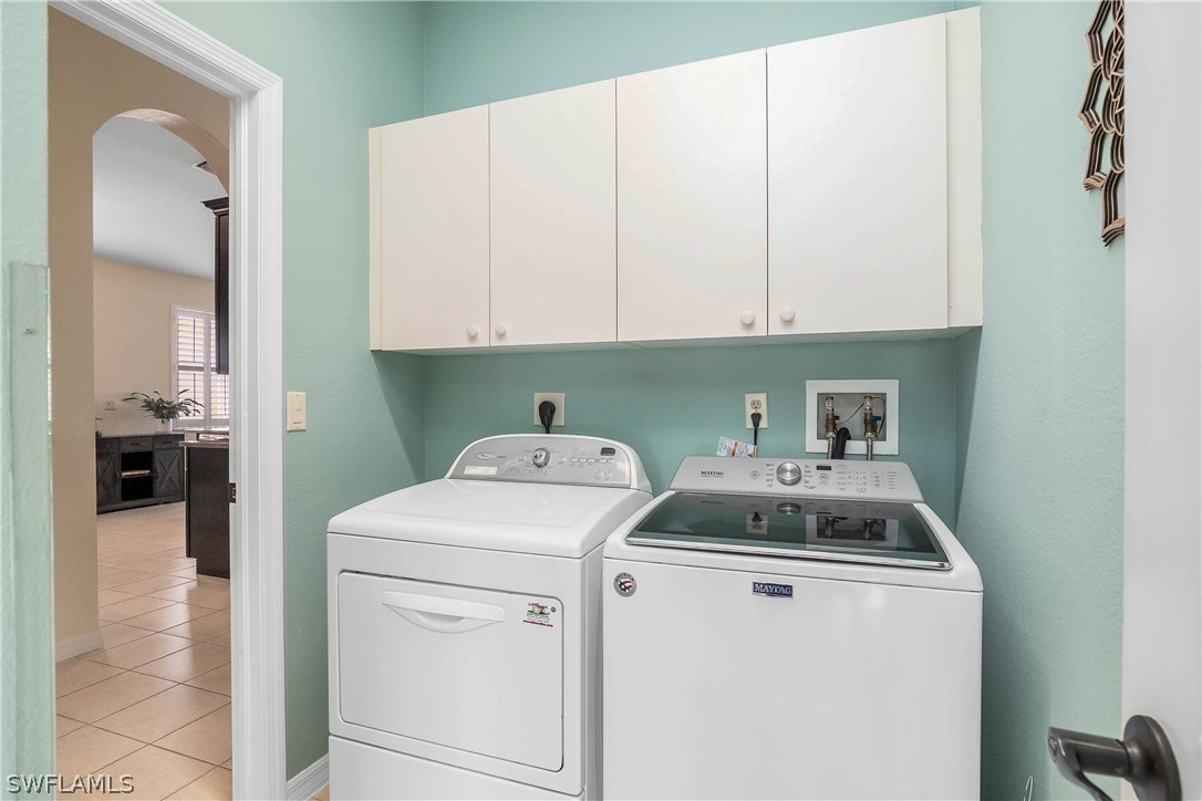 9036 Springview Loop Estero, FL 33928 - Photo 22 of 32 a utility room with dryer and washer