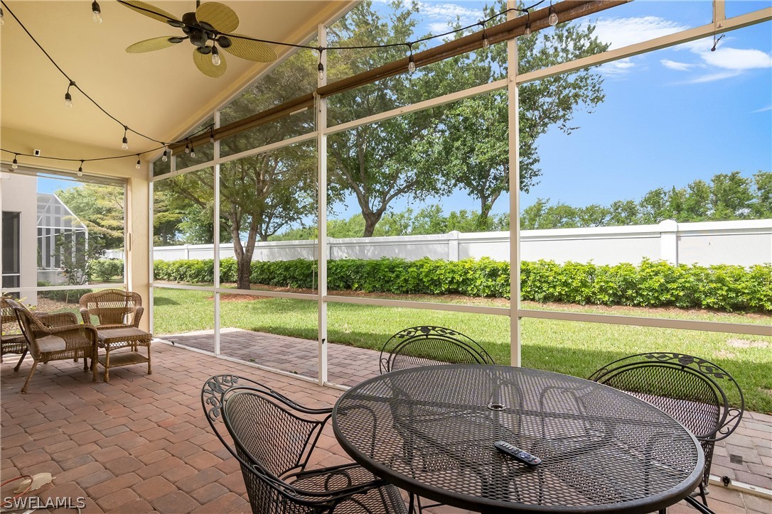 9036 Springview Loop Estero, FL 33928 - Photo 24 of 32 a view of a house with a porch and a backyard