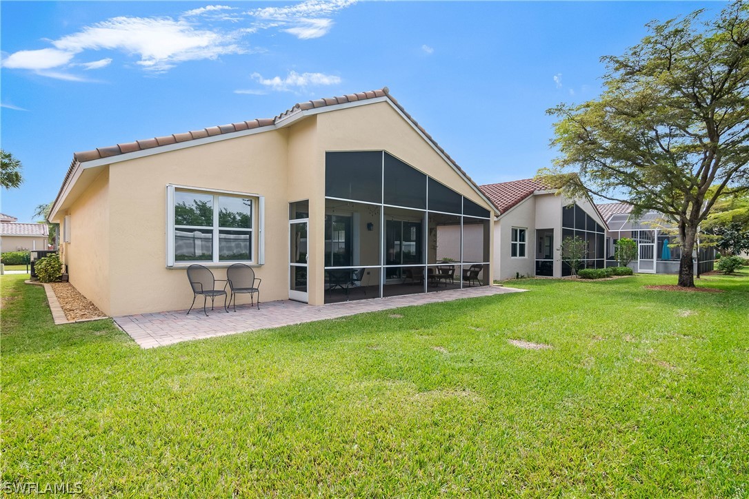 9036 Springview Loop Estero, FL 33928 - Photo 26 of 32 a view of a house with a yard and sitting area