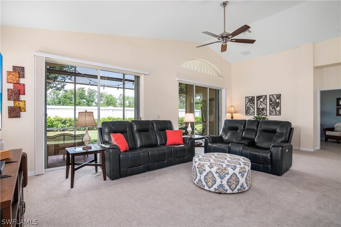 9036 Springview Loop Estero, FL 33928 - Photo 10 of 32 a living room with furniture and a large window