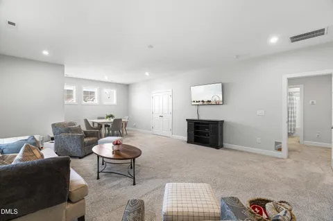 a en suite bathroom with a granite countertop sink and a mirror