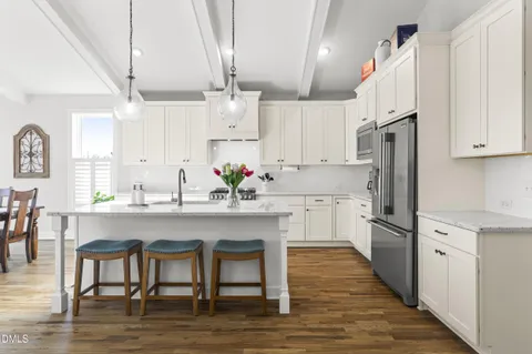 a view of a livingroom with furniture and a mirror
