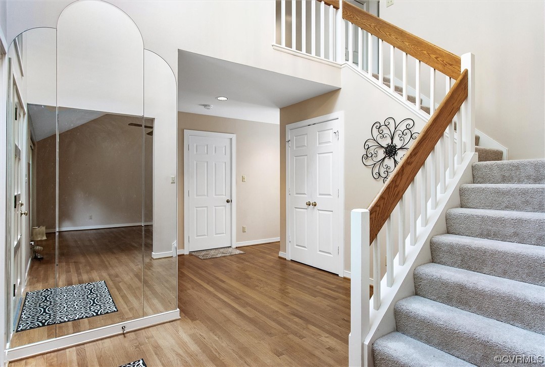 5826 Spinnaker Cove Road Midlothian, VA 23112 - Photo 7 of 38 Stairs with light hardwood flooring