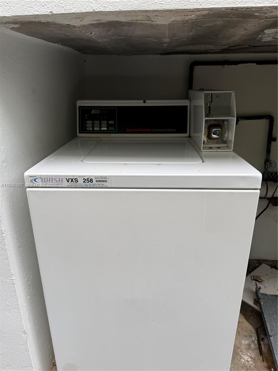 1011 9th Street, Unit 1 Miami Beach, FL 33139 - Photo 15 of 15 a utility room with washer and dryer