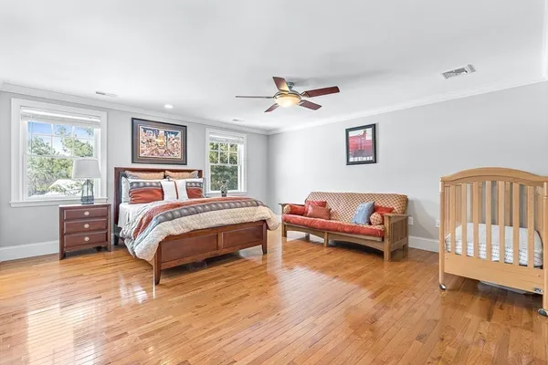 a bedroom with a bed and a chandelier
