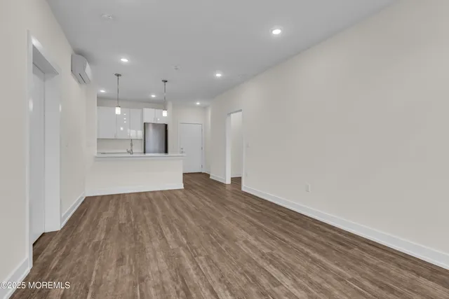 a view of kitchen with wooden floor