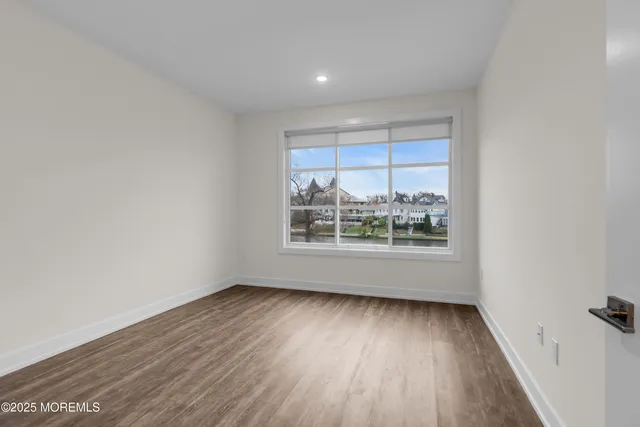 a view of wooden floor in an empty room