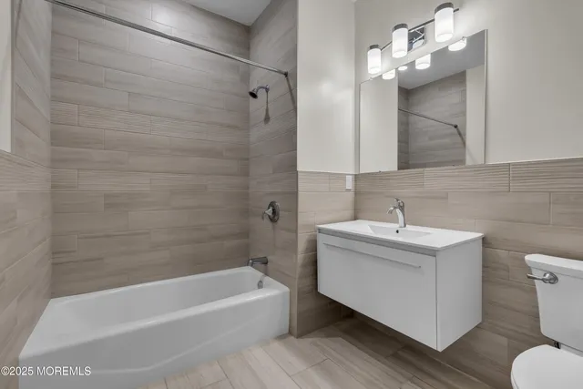 a view of room with window and wooden floor