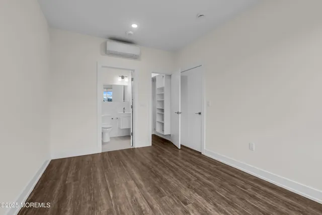 a bathroom with a toilet a sink and shower