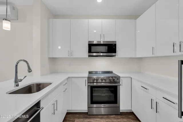 a kitchen with a sink and window