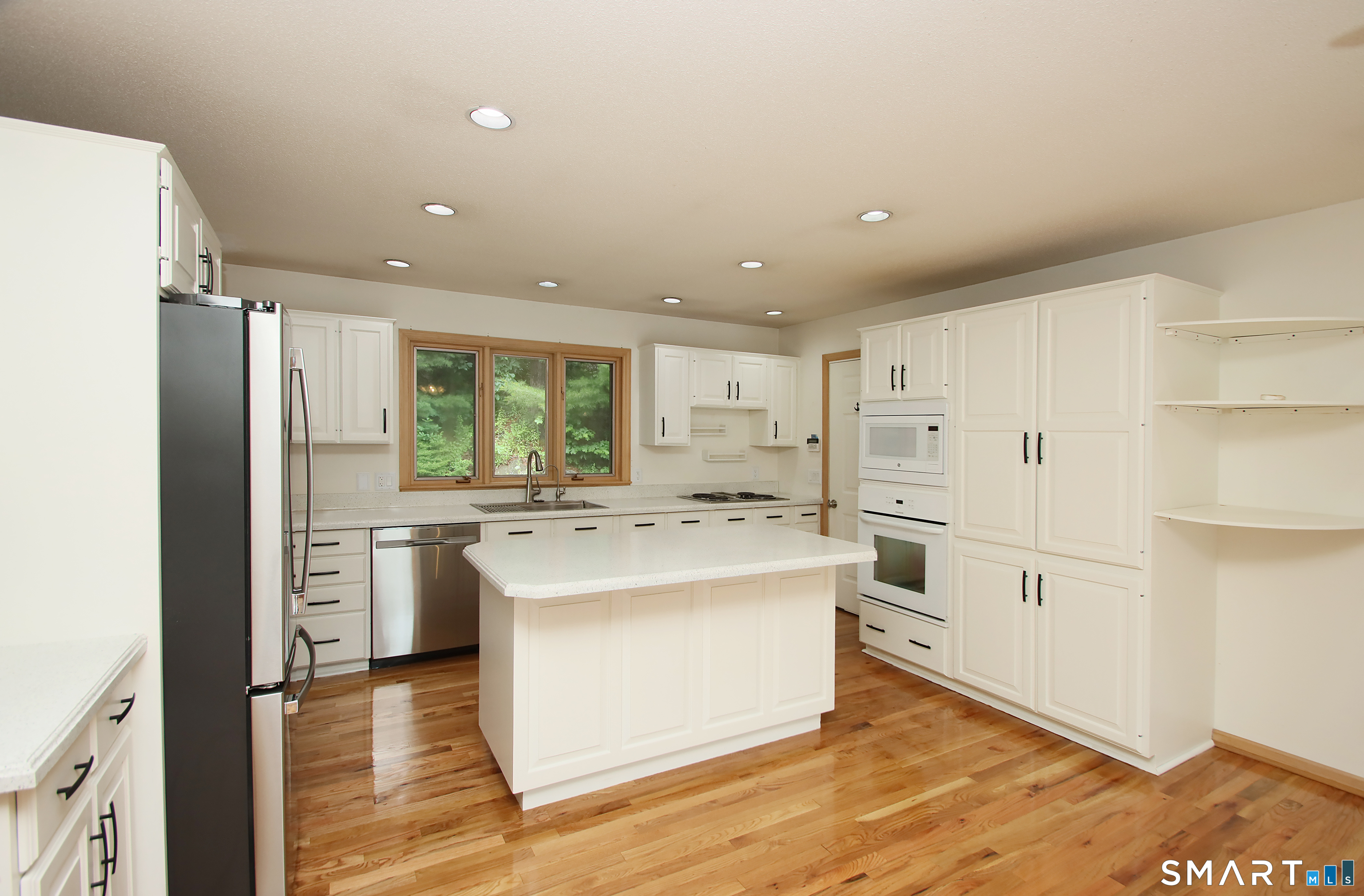 352 Center Street Wolcott, CT 06716 - Photo 11 of 40 a kitchen with stainless steel appliances a refrigerator and cabinets