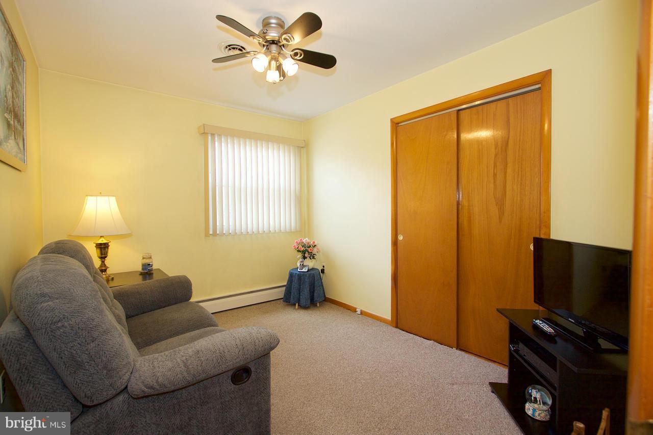 2307 Mills Road Fallston, MD 21047 - Photo 13 of 30 a living room with furniture a ceiling fan and a window