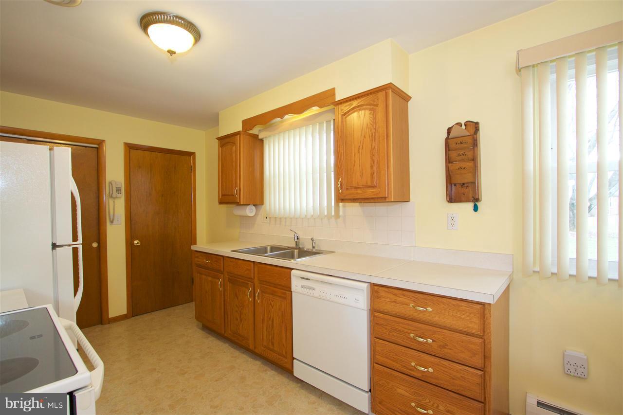 2307 Mills Road Fallston, MD 21047 - Photo 9 of 30 a kitchen with a refrigerator and a sink