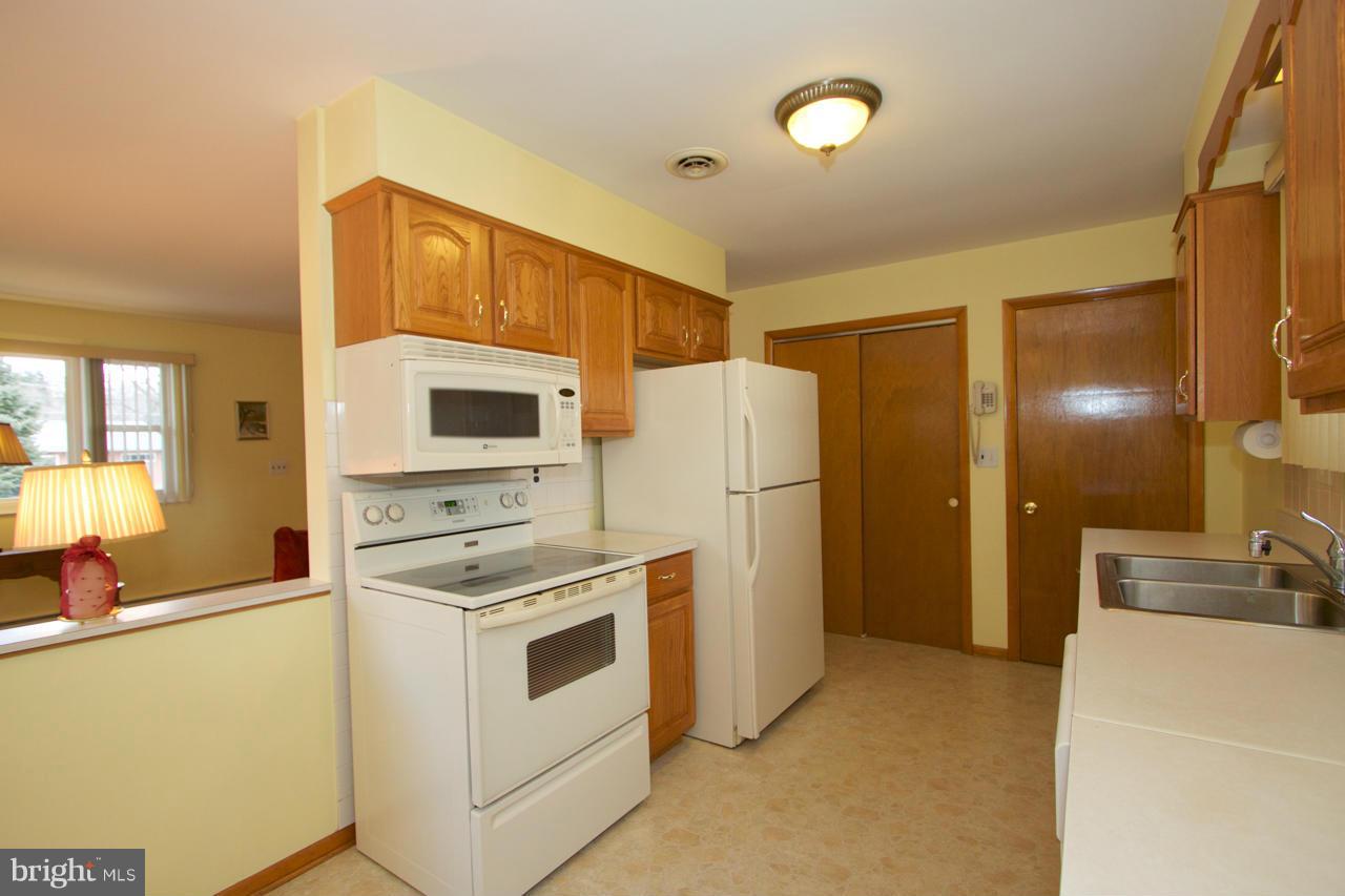 2307 Mills Road Fallston, MD 21047 - Photo 10 of 30 a kitchen that has a refrigerator and a stove