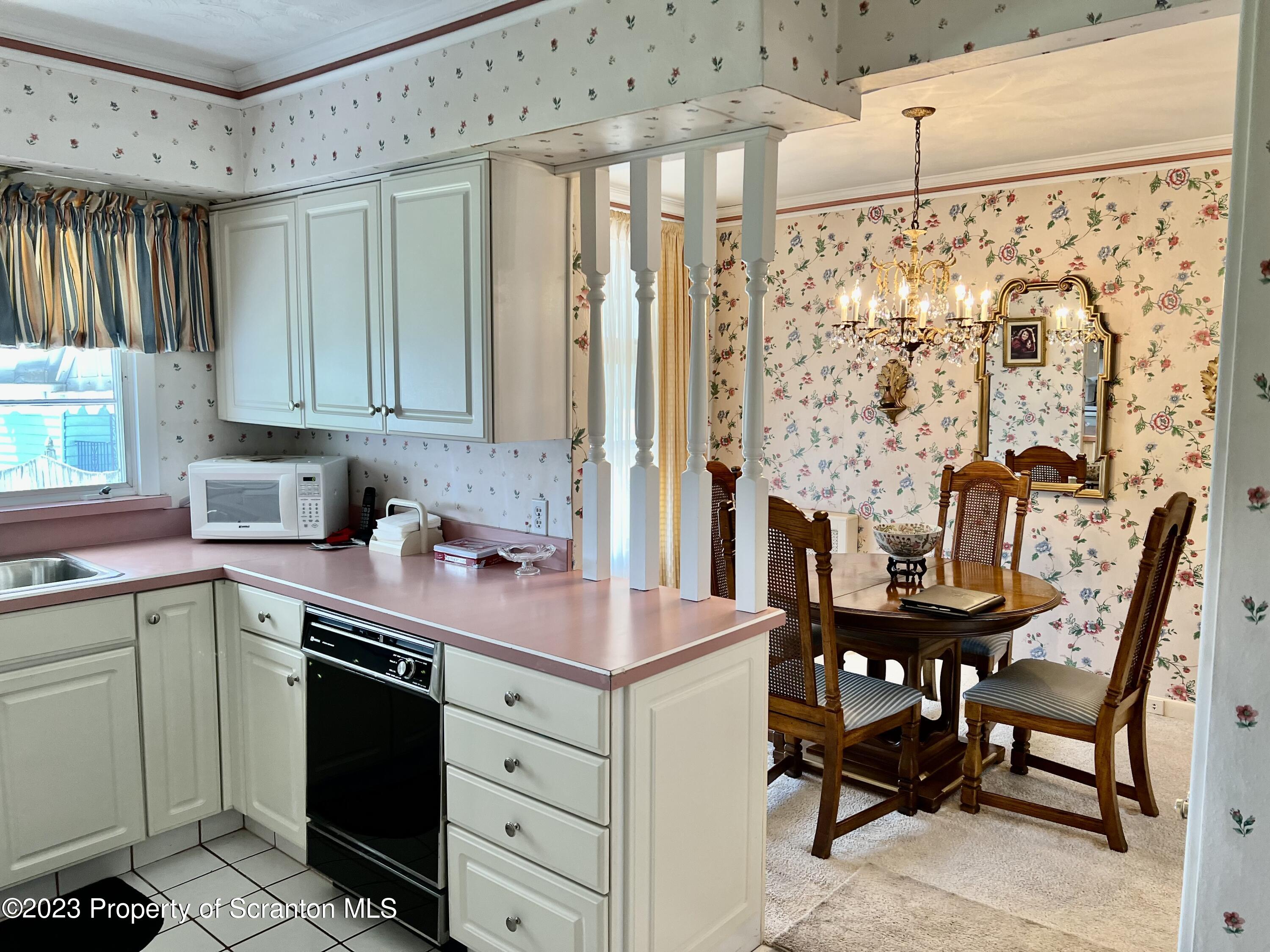204 Moosic Road Old Forge, PA 18518 - Photo 11 of 31 a kitchen with a stove a sink and a refrigerator