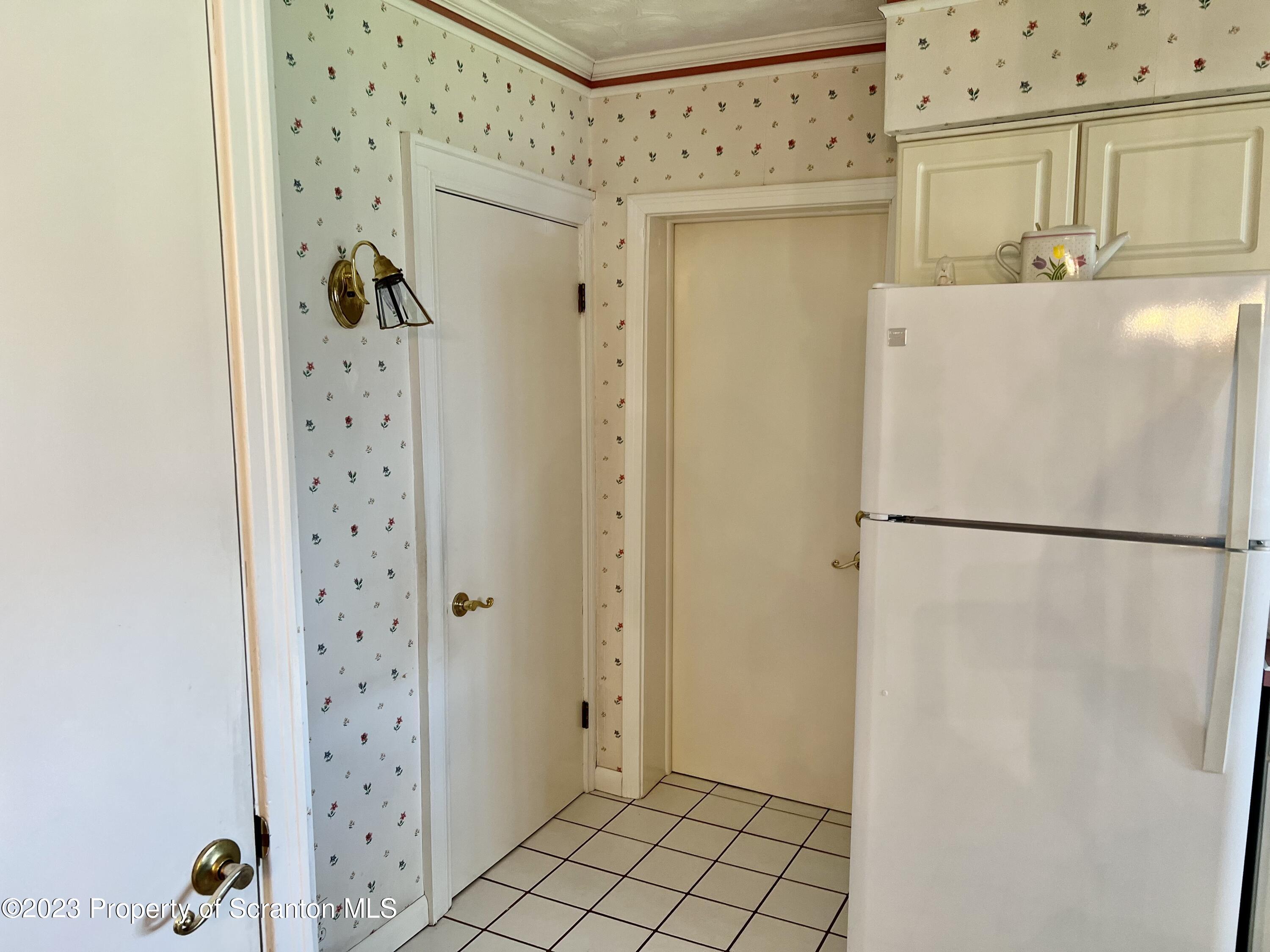 204 Moosic Road Old Forge, PA 18518 - Photo 14 of 31 a white refrigerator freezer sitting inside of a kitchen