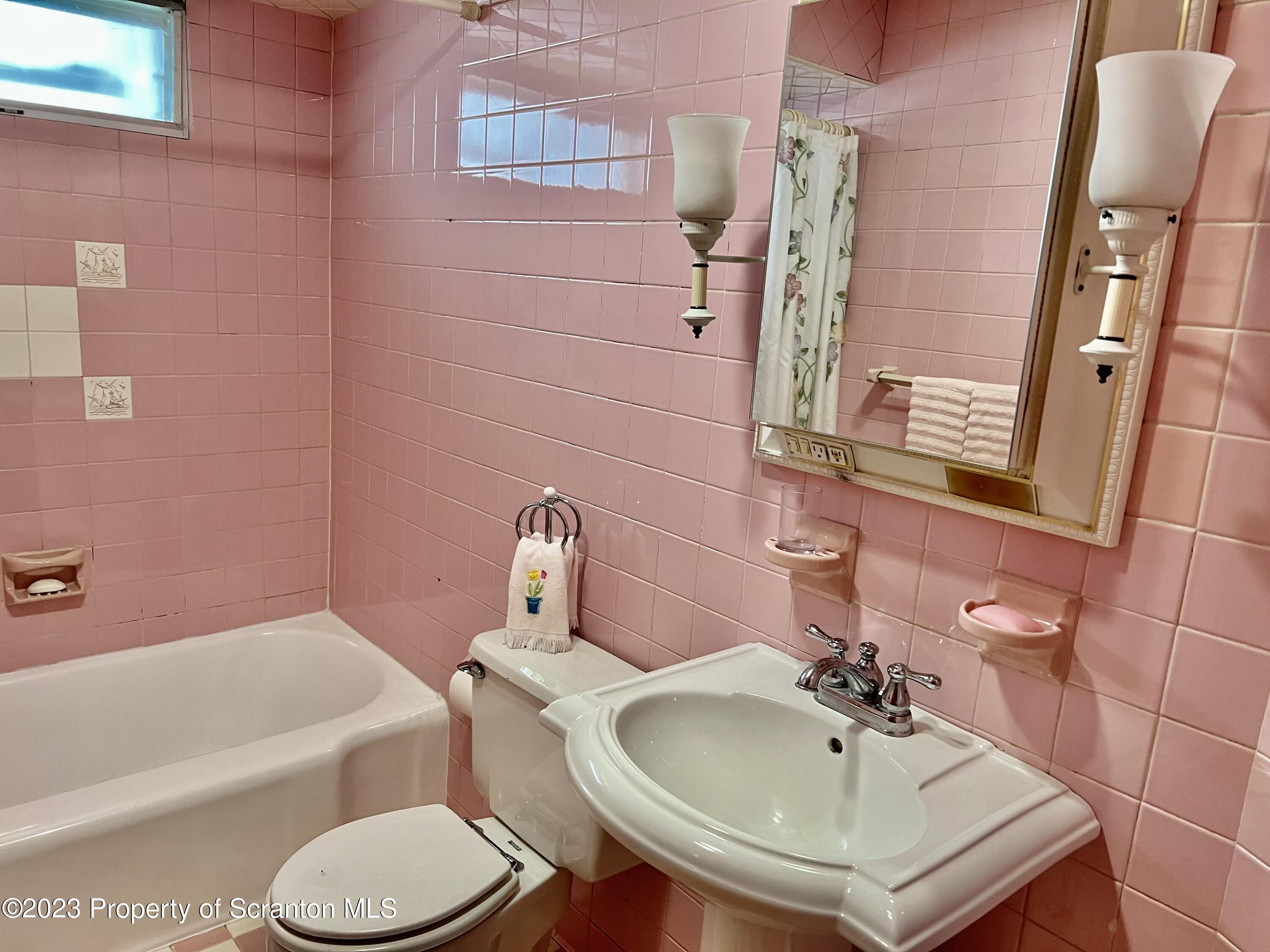 204 Moosic Road Old Forge, PA 18518 - Photo 16 of 31 a bathroom with a sink toilet and shower