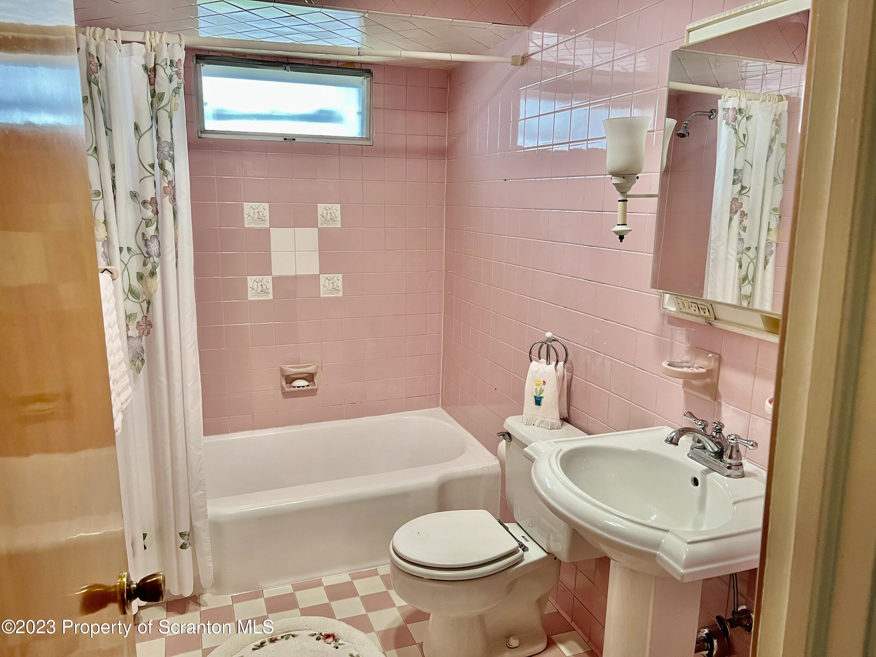 204 Moosic Road Old Forge, PA 18518 - Photo 17 of 31 a bathroom with a sink toilet and shower