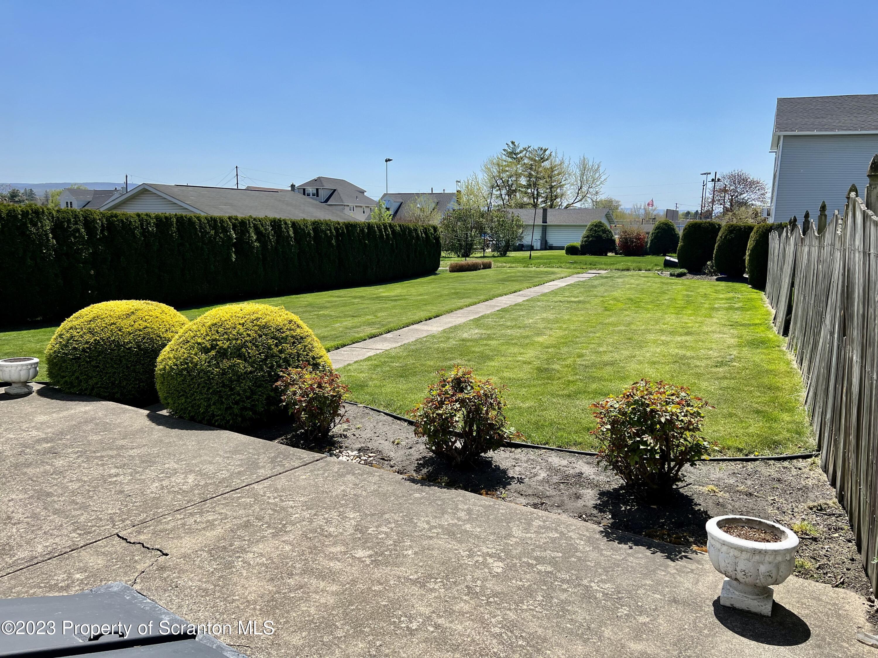 204 Moosic Road Old Forge, PA 18518 - Photo 2 of 31 a view of a garden with lawn chairs