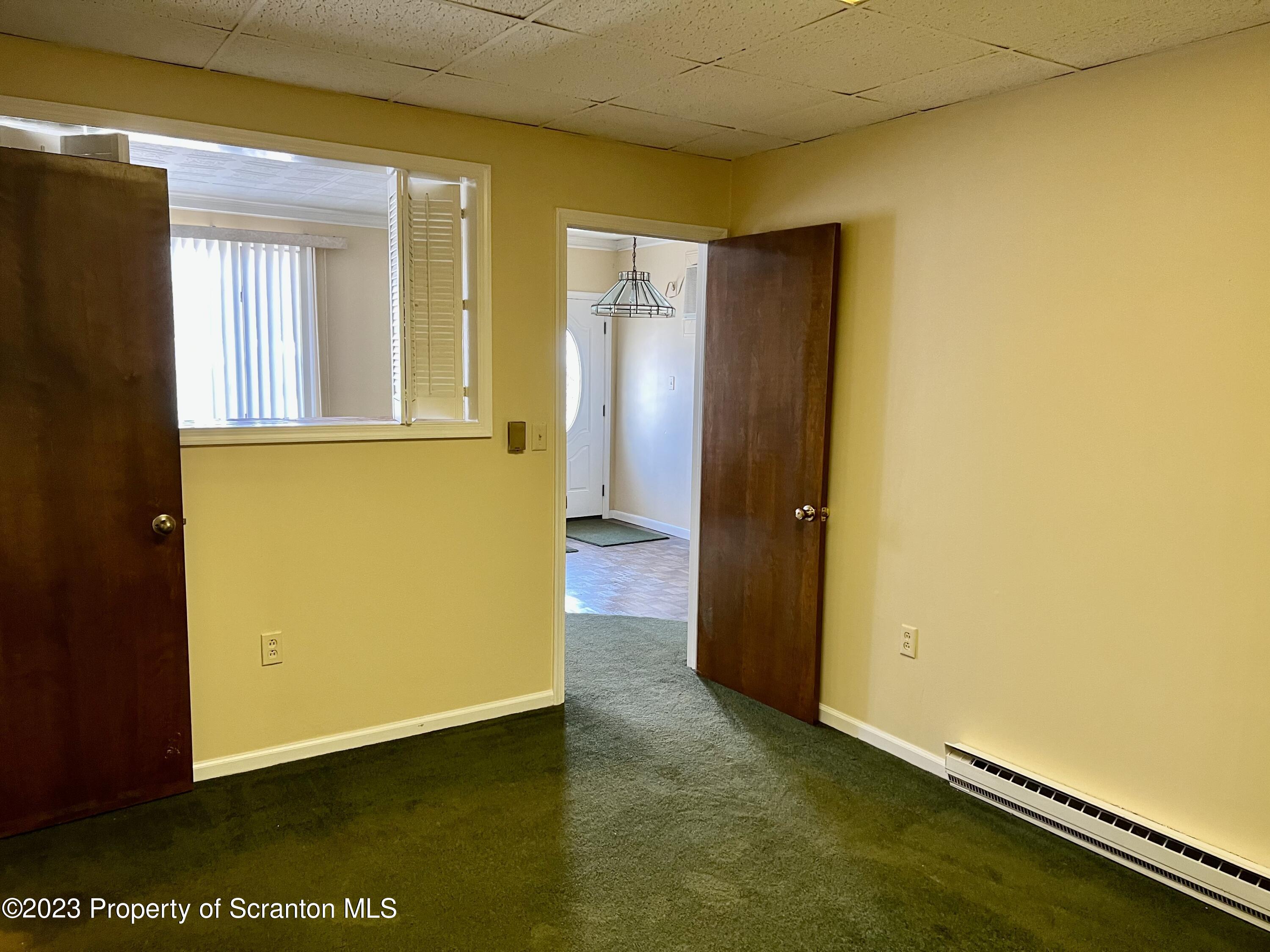204 Moosic Road Old Forge, PA 18518 - Photo 29 of 31 an empty room with a door